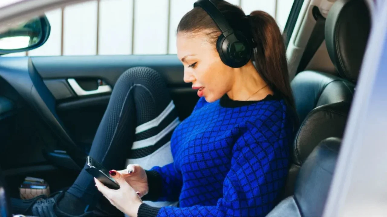 Woman listening to music on her cell phone