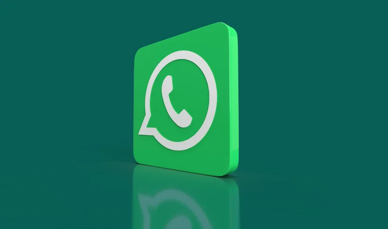 Logo WhatsApp disorot pada latar belakang hijau.