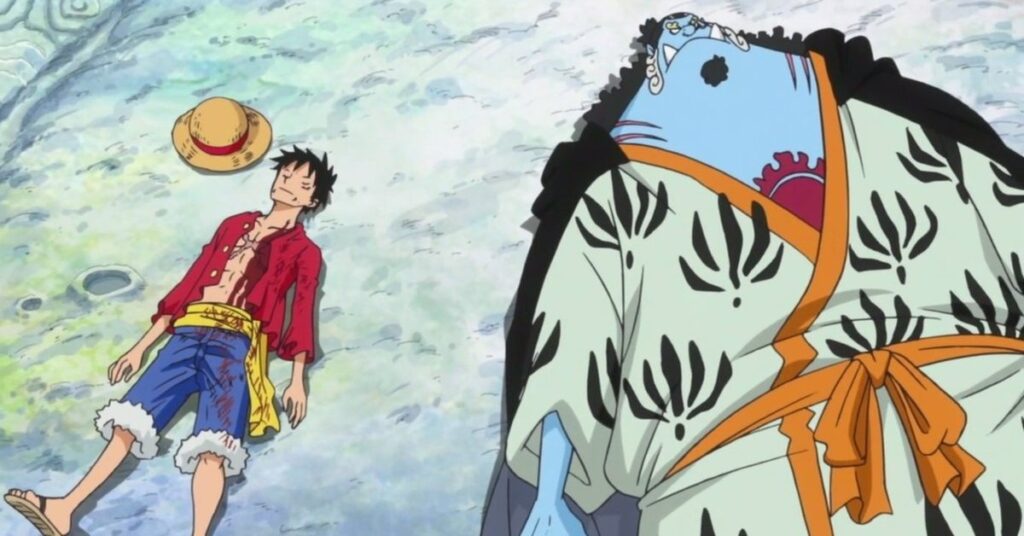 Luffy lying next to a fishman