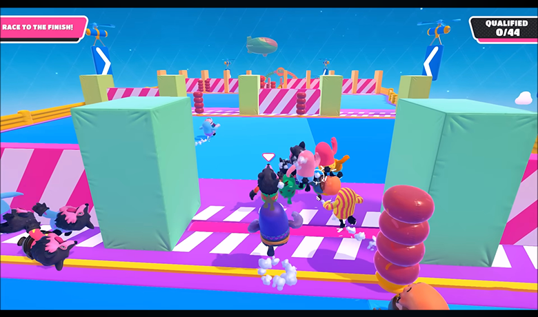 Screenshot with characters from the game Fall Guys in a colorful setting