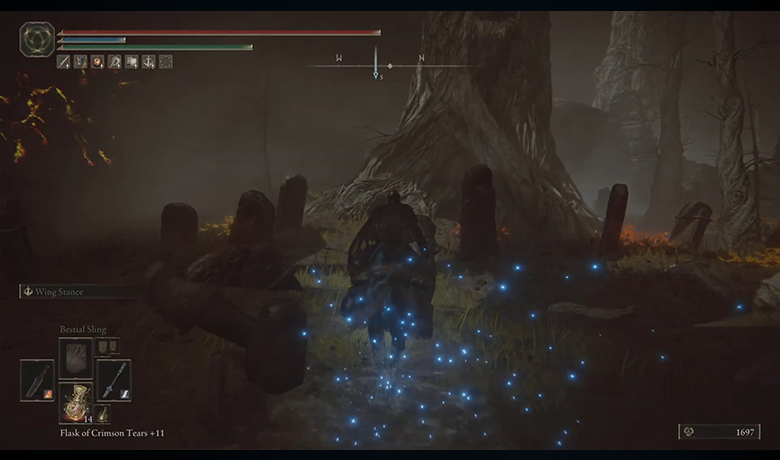Image of the player on top of his mount facing a tree